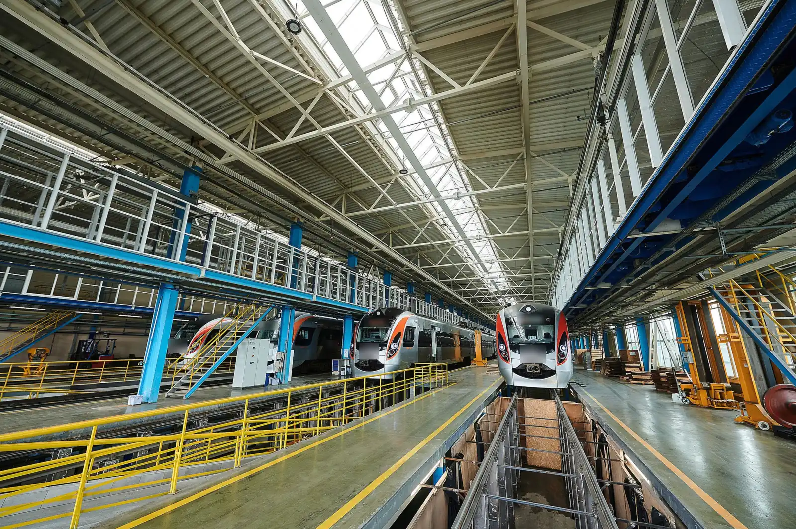 Rolling-stock maintenance hall: trains over the inspection pits